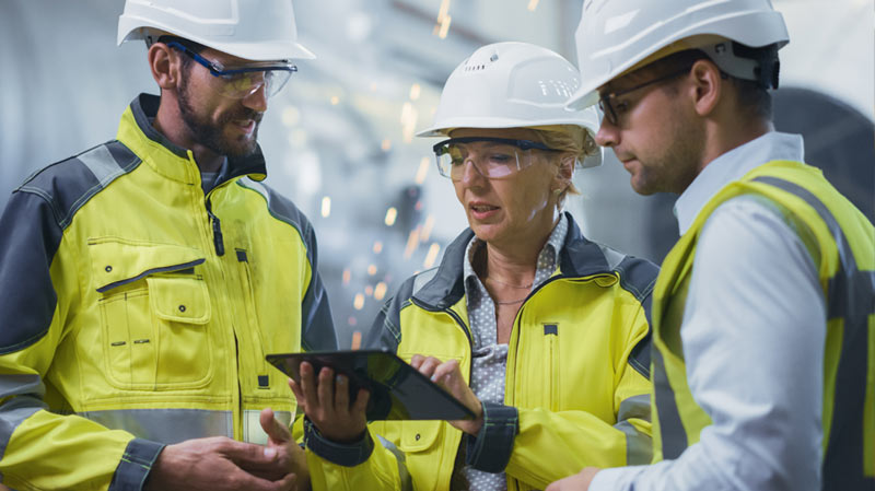 Workers discussing industrial change management